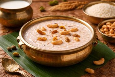 Traditional paal payasam served in a brass bowl garnished with cashews and raisins.