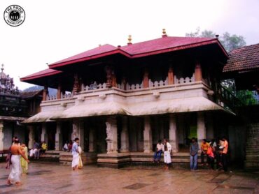 Majestic Kollur Mookambika Temple surrounded by lush greenery, a sacred spiritual destination in Karnataka's Western Ghats.