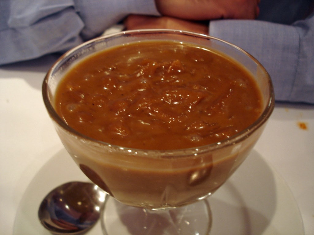 Traditional Kerala Palada Payasam served in a brass bowl, showcasing its creamy texture and rich heritage.
