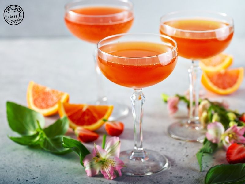"A refreshing glass of Orange Dream Punch with a creamy citrus blend, garnished with orange slices.