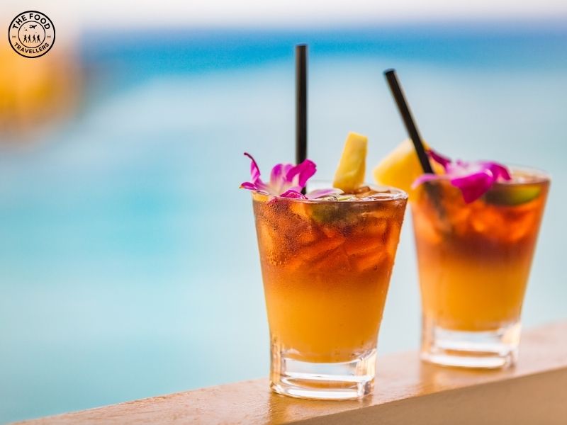 A vibrant Tropical Mermaid Breezer Mocktail with a colorful mix of fruits, served in a glass with a tropical garnish, capturing a refreshing, paradise-like vibe.