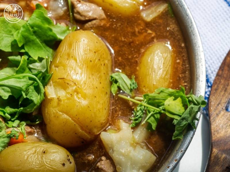 A comforting bowl of Veg Irish Stew with tender vegetables in a flavorful broth.