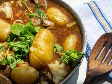 A hearty bowl of Veg Irish Stew, filled with colorful vegetables and rich, savory broth.