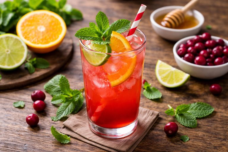Cranberry Citrus Bliss mocktail with mint, lime, and orange served in a glass