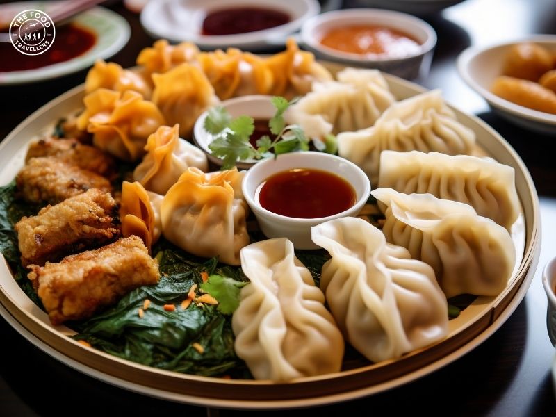 Delicious veg fried momos served with a side of flavorful momo sauce, perfect for dipping.