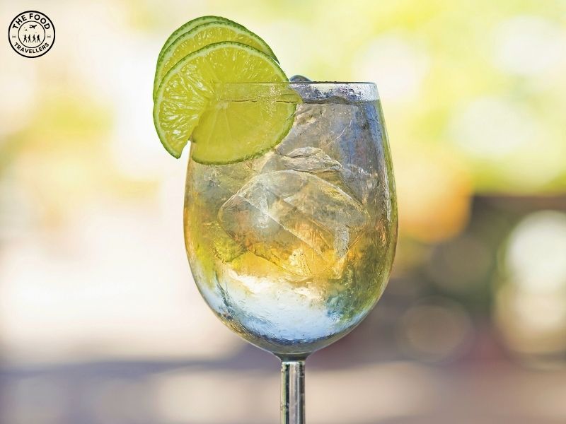 Here's an alt tag for the Mango-Lime-Spritzer-Mocktail: **"Mango Lime Spritzer Mocktail in a glass with a lime slice and mint garnish, served with sparkling bubbles