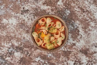 Vegetarian Chhutagi Ladakhi bow-tie pasta stew with tofu and vegetables